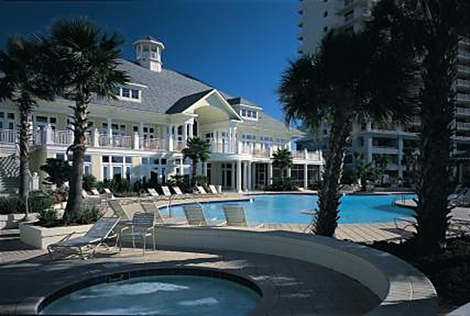 Palms surrounding the pool and clubhouse at The Beach Club, Gulf Shores