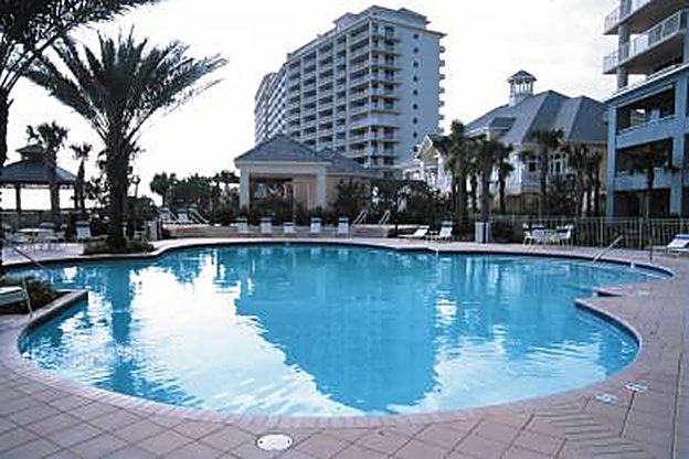Palm and planting installation around the resort pool at The Beach Club, Gulf Shores