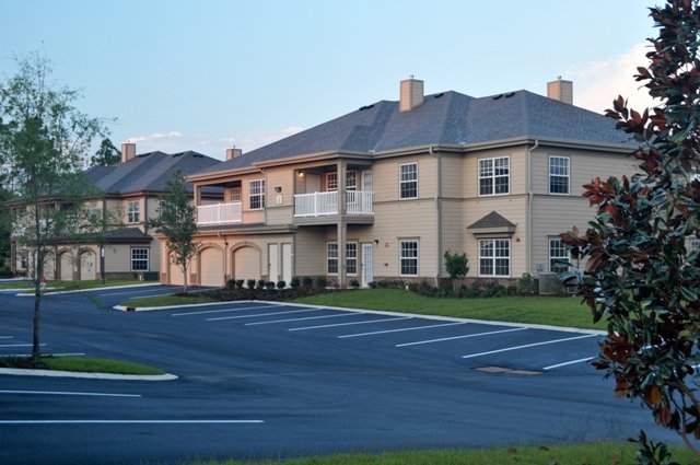 Longleaf Pines apartment buildings at dusk with established landscaping