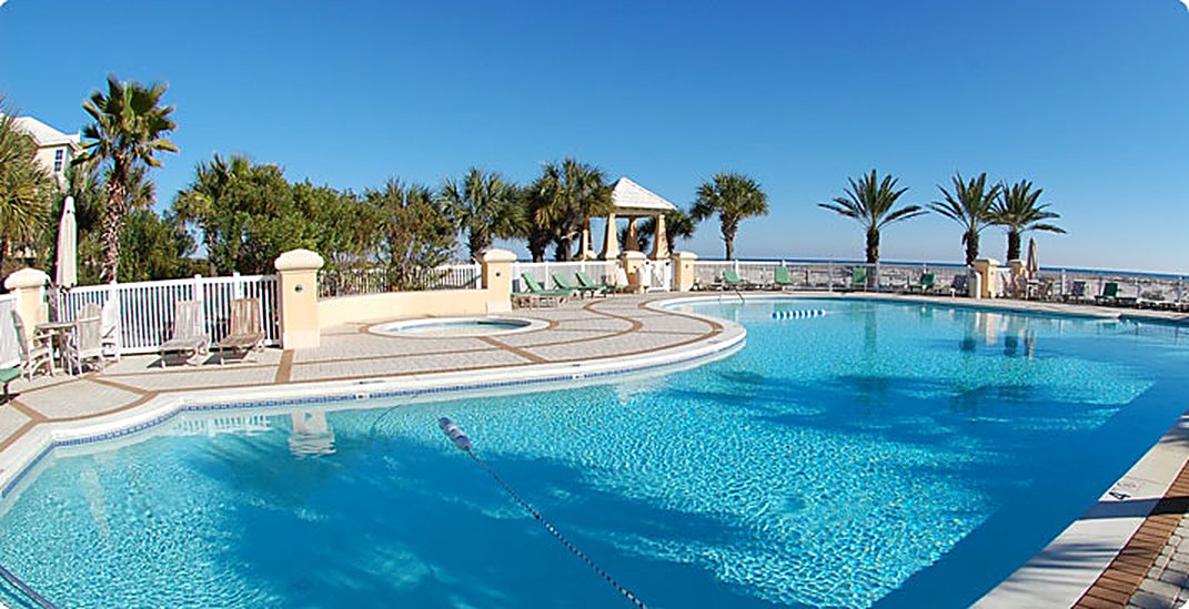 Beachfront pool and palm installation at Martinique on the Gulf, Gulf Shores