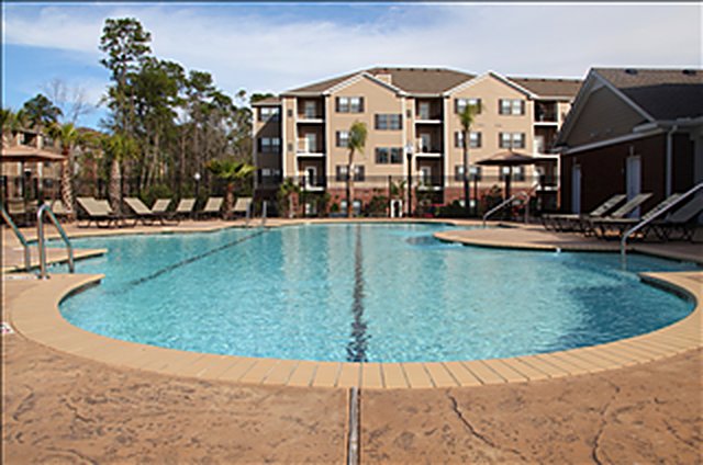 Foundation planting and palms installed at The Retreat at Schillinger clubhouse, Mobile