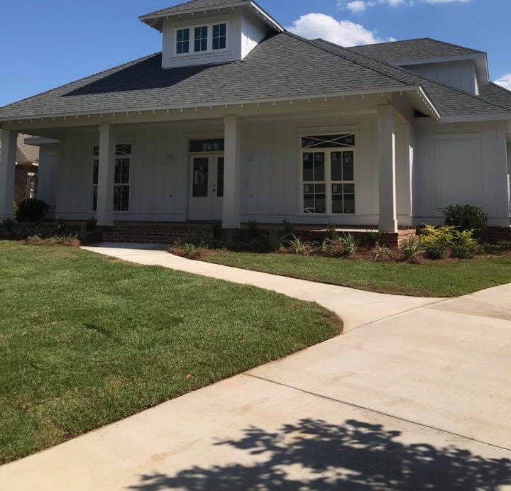 Fresh sod and foundation planting at a newly built home